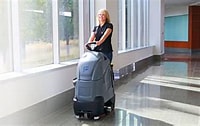 chariot scrubber woman with a chariot floor scrubber